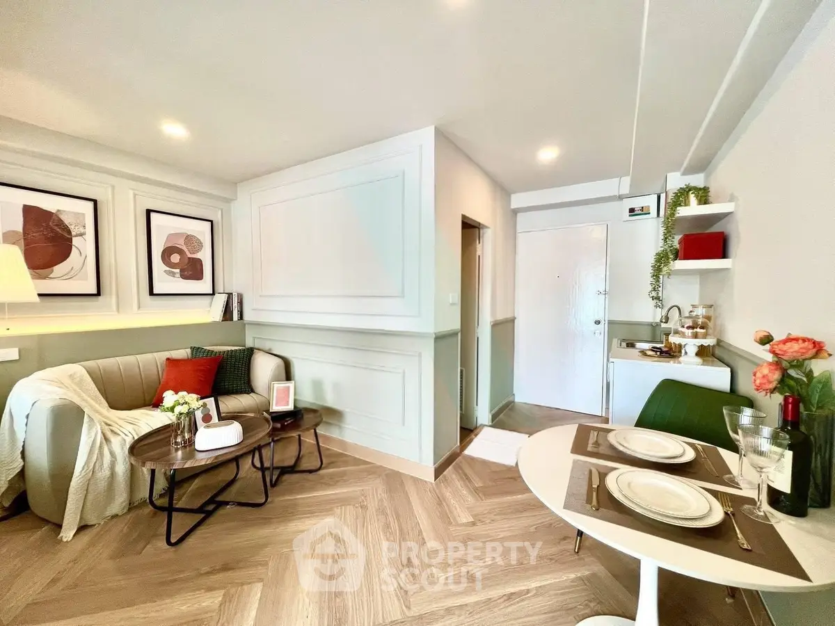 Chic modern living room with stylish decor and cozy dining area in open layout apartment.