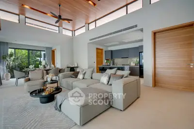Luxurious open-plan living room with modern decor and natural light