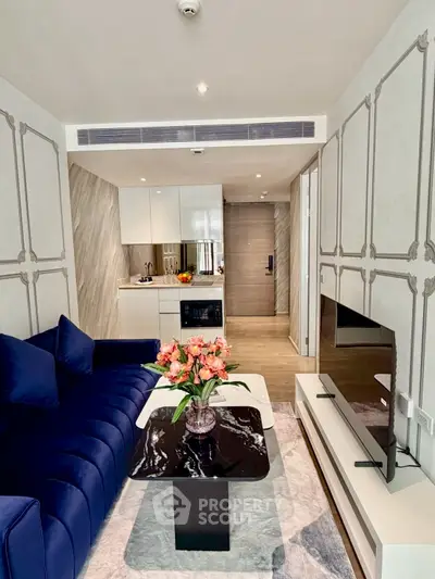 Modern living room with elegant decor and open kitchen layout