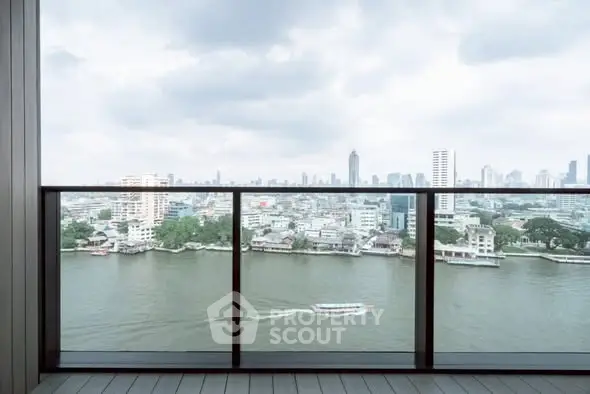 Stunning river view from a modern balcony in a high-rise apartment.