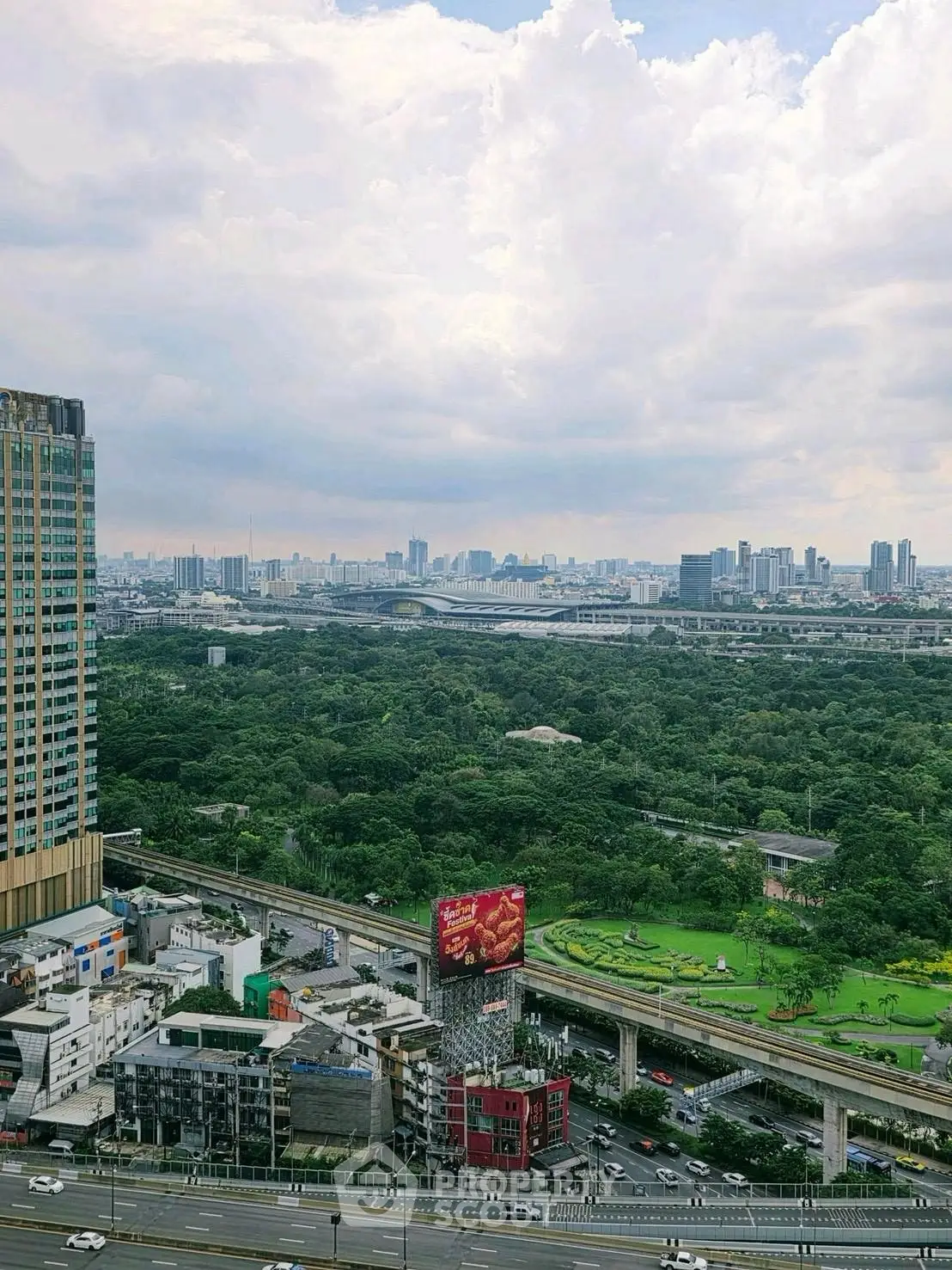 Stunning cityscape view with lush greenery and modern skyline, perfect for urban living.