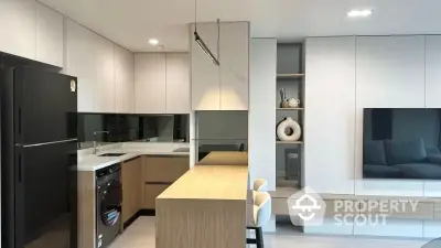 Modern kitchen with sleek design, featuring built-in appliances and stylish cabinetry.