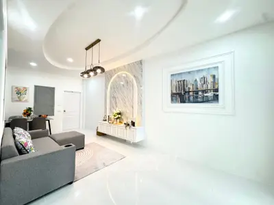 Modern living room with stylish decor and elegant lighting in a contemporary home.