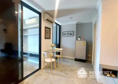 Modern apartment interior with dining area and air conditioning