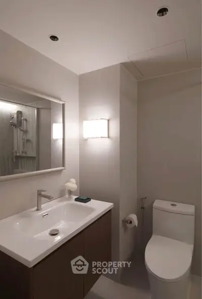 Modern bathroom with sleek fixtures and elegant lighting