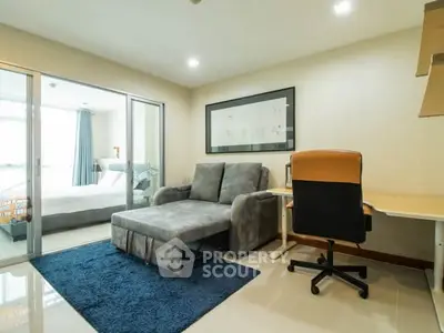 Modern living room with cozy sofa and study area in a bright apartment