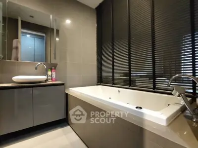 Modern bathroom with sleek bathtub and stylish blinds
