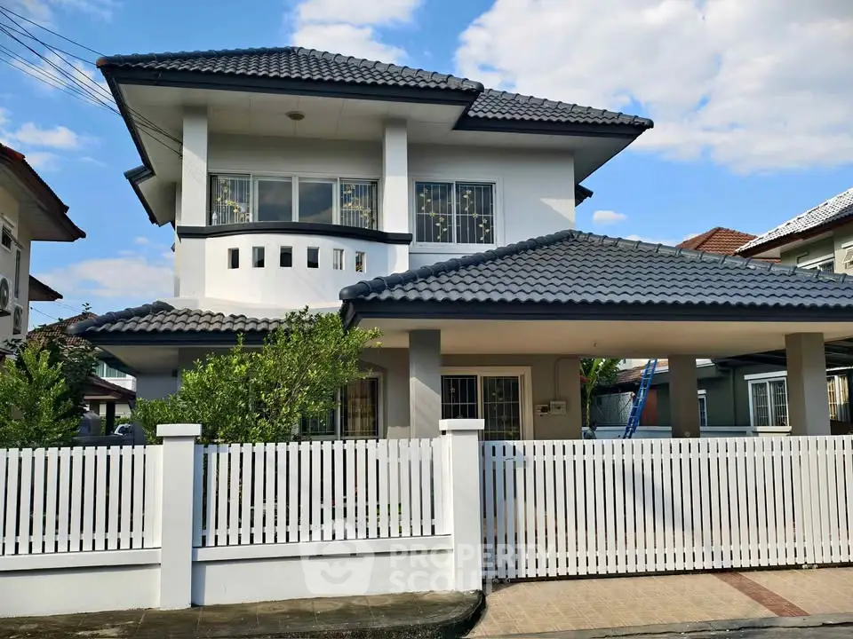 Charming two-story house with modern design and spacious fenced yard