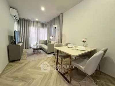 Modern living room with elegant dining area and stylish decor