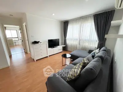 Spacious living room with modern decor and natural light