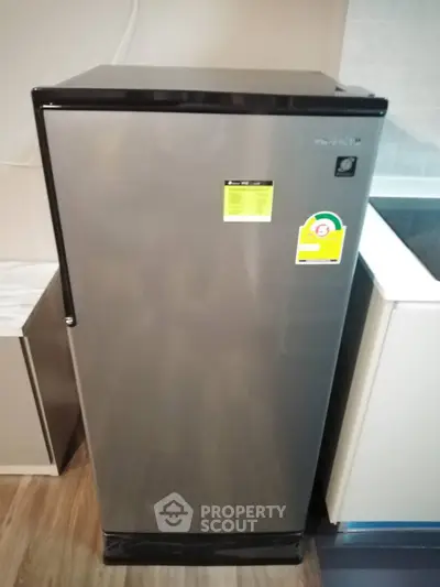 Modern stainless steel refrigerator in sleek kitchen setting
