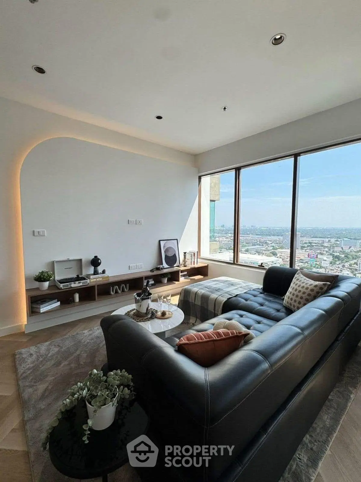 Luxurious living room with panoramic city view and modern decor