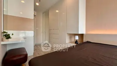 Modern bedroom with sleek built-in wardrobes and cozy lighting