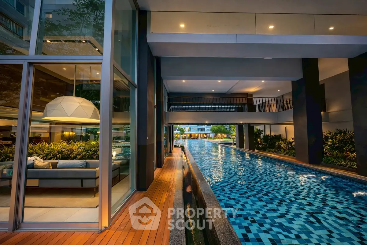 Luxurious modern apartment with stunning poolside view and elegant interior design.