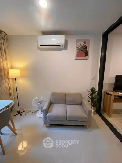 Modern living room with air conditioning and stylish decor in a cozy apartment.
