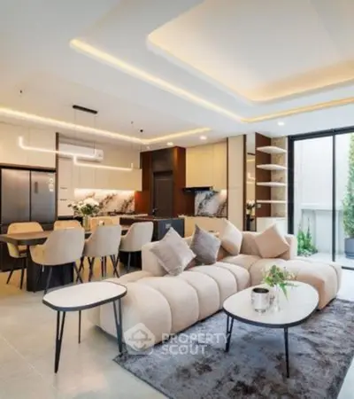 Luxurious open-plan living room with modern kitchen and elegant decor