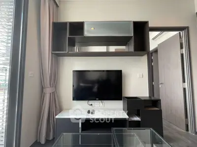Modern living room with sleek TV setup and stylish shelving