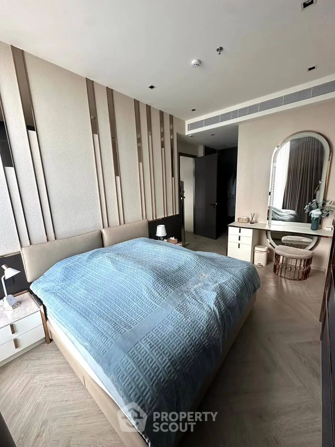 Luxurious bedroom with modern decor and elegant furnishings in a high-end apartment.