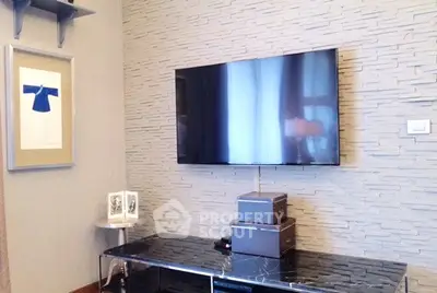 Modern living room with wall-mounted TV and stylish decor