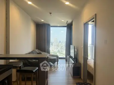 Modern apartment living room with city view and cozy furnishings