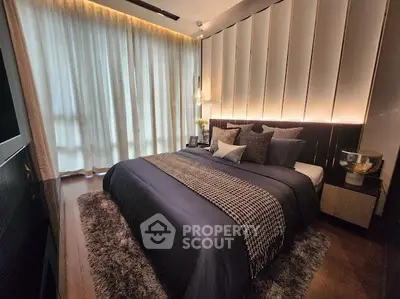 Luxurious bedroom with plush bedding and ambient lighting, perfect for relaxation and comfort.