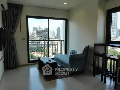 Modern apartment living room with city view and stylish furniture.