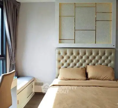 Luxurious bedroom with tufted headboard and elegant decor