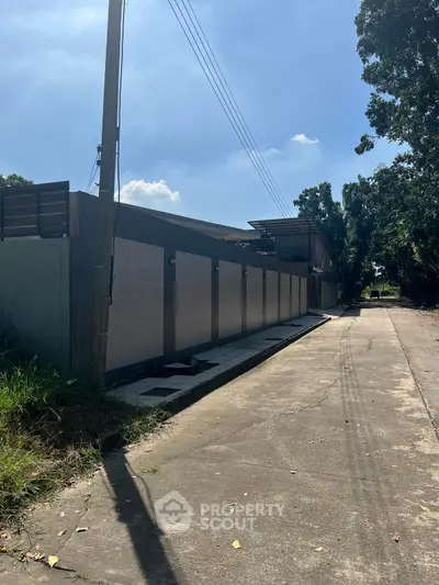 Modern building exterior with sleek design and lush surroundings