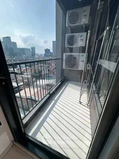 Modern balcony with city view and air conditioning units, perfect for urban living.