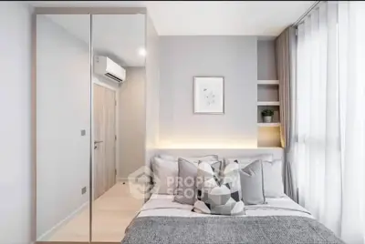 Modern bedroom with stylish decor and ample natural light
