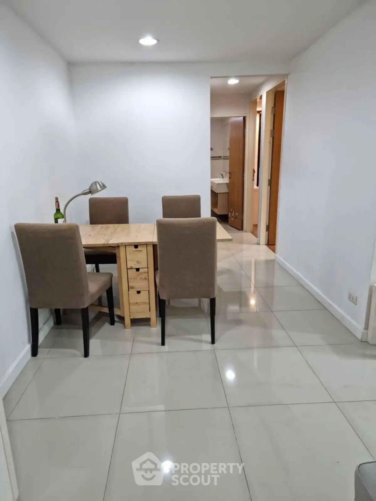 Cozy dining area with modern table and chairs in a bright apartment