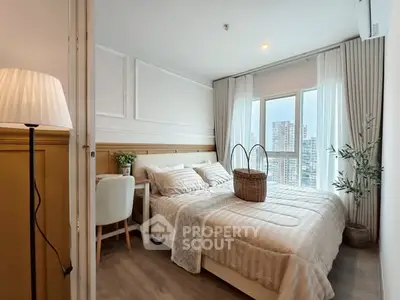 Cozy bedroom with city view, elegant decor, and natural light