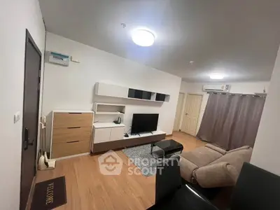 Modern living room with stylish furniture and wooden flooring in a cozy apartment.
