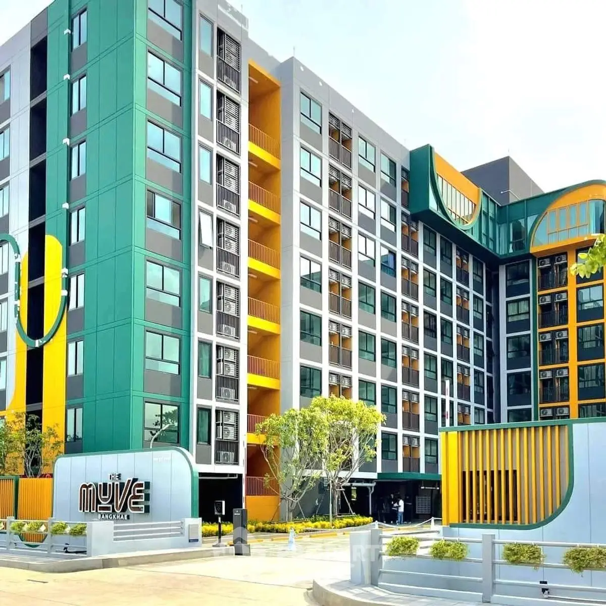Modern apartment building with vibrant colors and unique architectural design.