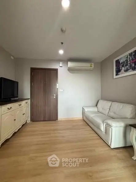 Spacious living room with elegant decor and wooden flooring