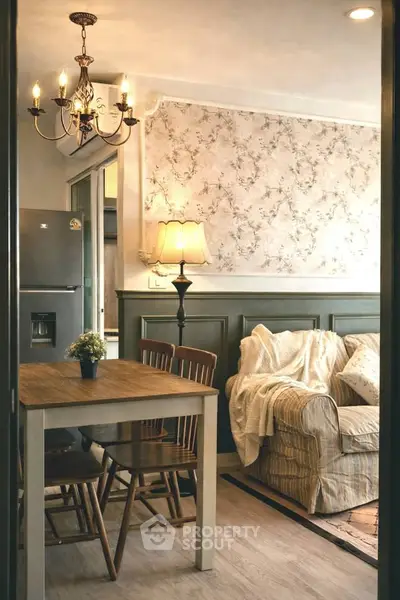 Charming living room with cozy seating and elegant dining area