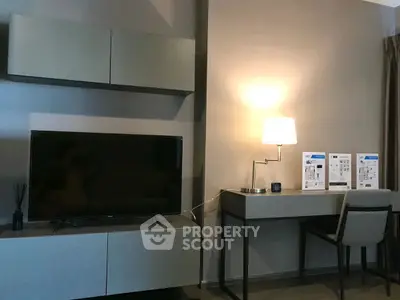 Modern living room with sleek TV unit and stylish desk setup