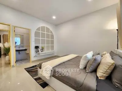 Spacious modern bedroom with elegant decor and cozy ambiance