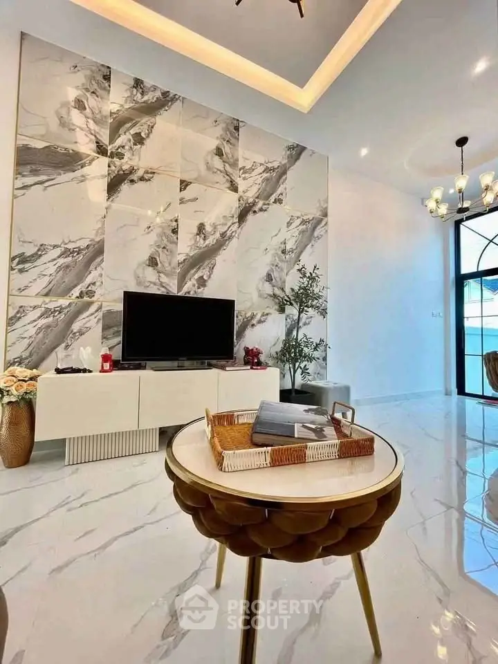 Luxurious modern living room with marble accents and elegant decor