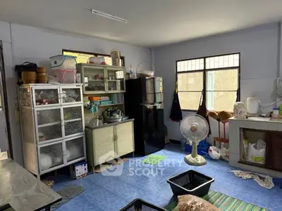 Cozy kitchen with ample storage and natural light