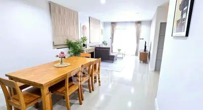 Spacious modern living room with dining area and natural light