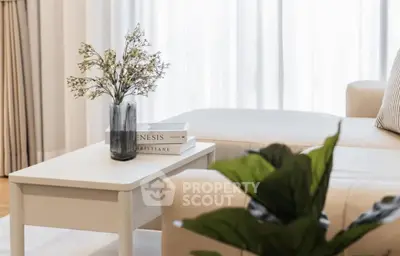 Elegant living room with cozy white sofa and stylish decor