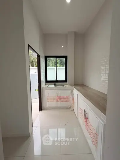 Modern kitchen with sleek design and ample natural light