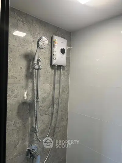 Modern bathroom with sleek shower and elegant tile design