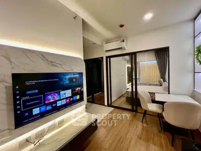 Modern living room with stylish decor and smart TV in a cozy apartment