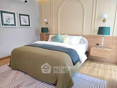 Luxurious bedroom with elegant decor and cozy bedding in a modern apartment.