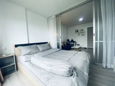 Modern bedroom with sliding glass doors and stylish decor