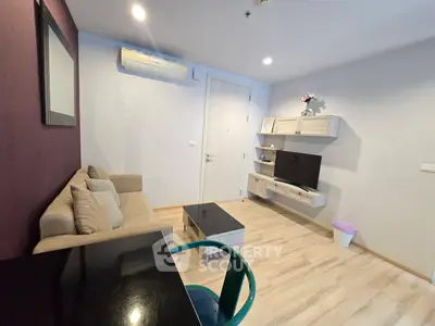 Cozy living room with modern decor and air conditioning in a stylish apartment.