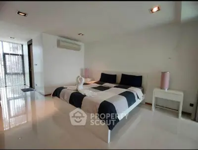 Modern bedroom with stylish decor and natural light