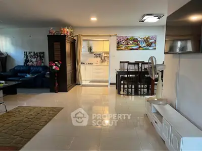 Spacious living room with dining area and modern kitchen in open layout